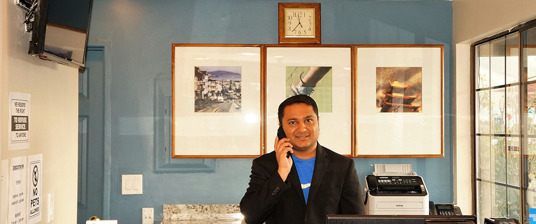Staff at front desk at Executive Inn Milpitas. Welcome To Executive Inn Milpitas.